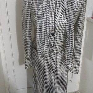 Blouse, skirt, sequined blazer, and scarf.